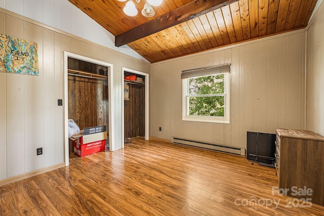 61 Magnolia Dr, Canton, NC 28716 - unfurnished bedroom with a baseboard radiator, wood finished floors, wood ceiling, multiple closets, and a chandelier