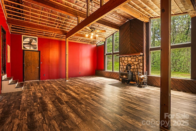 61 Magnolia Dr, Canton, NC 28716 - unfurnished living room with a wood stove, ceiling fan, hardwood / wood-style flooring, and stairway