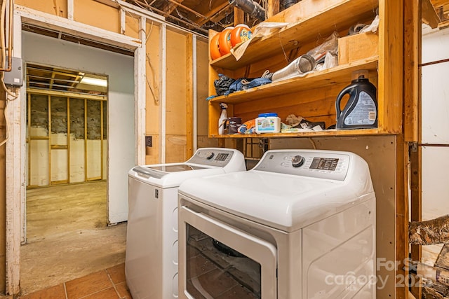 61 Magnolia Dr, Canton, NC 28716 - laundry area with washing machine and clothes dryer and tile patterned floors