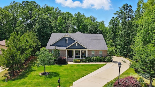 161 Leaning Tower Dr, Mooresville, NC 28117 - craftsman-style house featuring brick siding and a front lawn