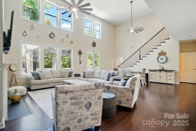 161 Leaning Tower Dr, Mooresville, NC 28117 - living room with ceiling fan, dark wood-type flooring, a high ceiling, and stairs