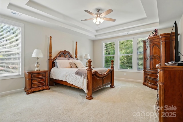 161 Leaning Tower Dr, Mooresville, NC 28117 - bedroom with a raised ceiling, baseboards, light carpet, and a ceiling fan