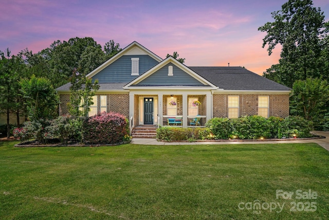 161 Leaning Tower Dr, Mooresville, NC 28117 - view of front of home with a porch, brick siding, and a front yard
