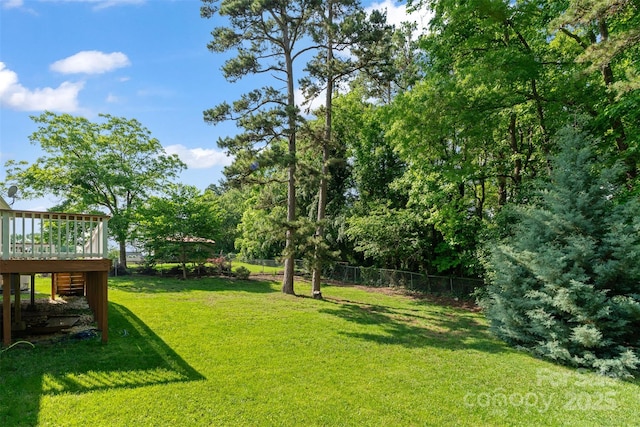 view of yard with a wooden deck