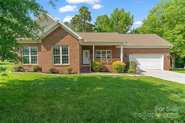 ranch-style home with covered porch, brick siding, a front yard, and concrete driveway