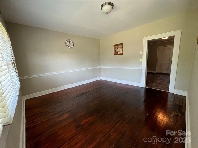 168 Grove St, Mocksville, NC 27028 - spare room featuring dark wood-style flooring and baseboards