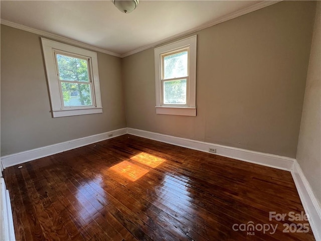 168 Grove St, Mocksville, NC 27028 - empty room featuring plenty of natural light, hardwood / wood-style flooring, crown molding, and baseboards