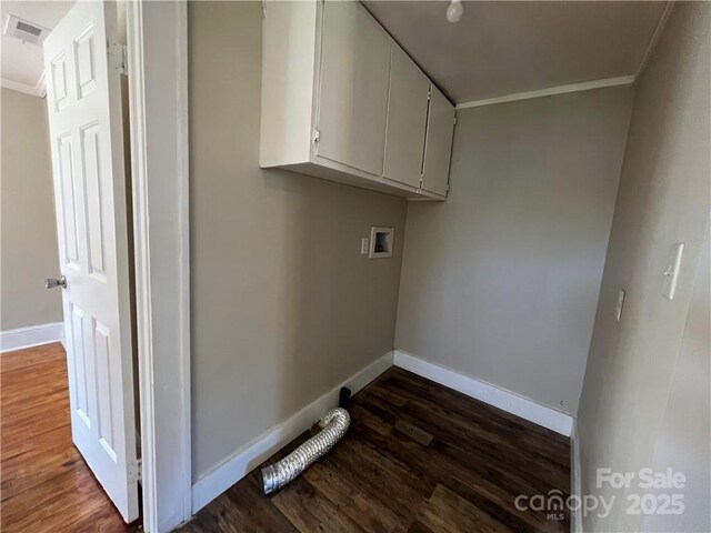 168 Grove St, Mocksville, NC 27028 - laundry area with ornamental molding, cabinet space, dark wood-style flooring, baseboards, and washer hookup