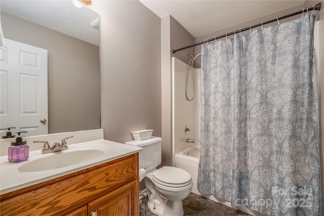 bathroom featuring a textured ceiling, toilet, vanity, and shower / bath combo with shower curtain