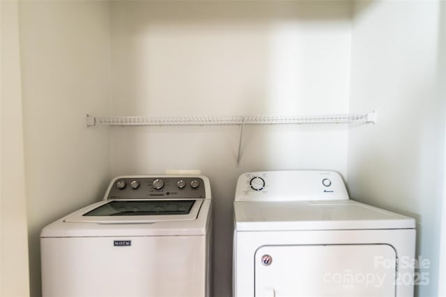 washroom with washer and clothes dryer