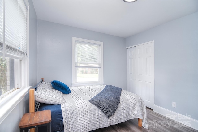 3623 Braden Dr, Charlotte, NC 28216 - bedroom with wood finished floors, a closet, and baseboards