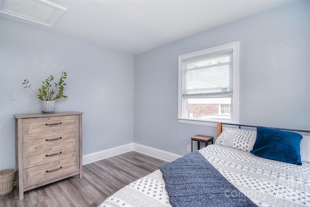 3623 Braden Dr, Charlotte, NC 28216 - bedroom featuring wood finished floors, attic access, and baseboards