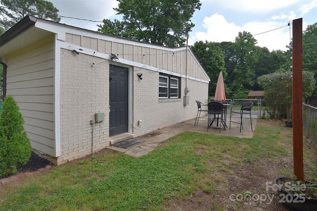 3623 Braden Dr, Charlotte, NC 28216 - rear view of house featuring a patio and brick siding