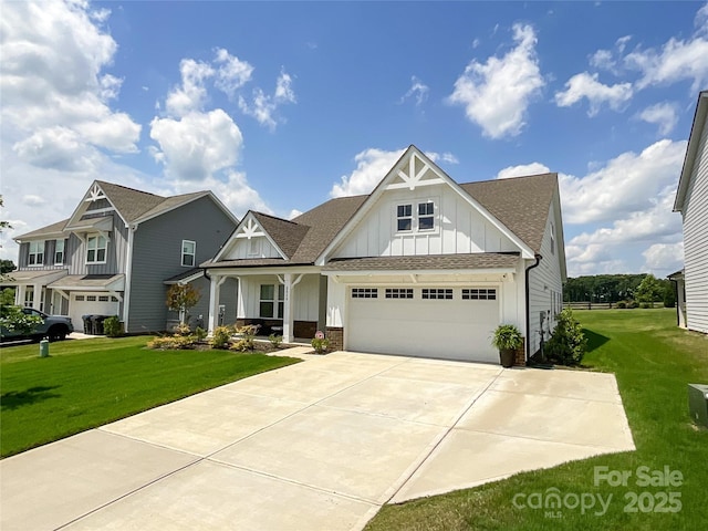 craftsman-style house with board and batten siding, concrete driveway, a front lawn, a shingled roof, and an attached garage