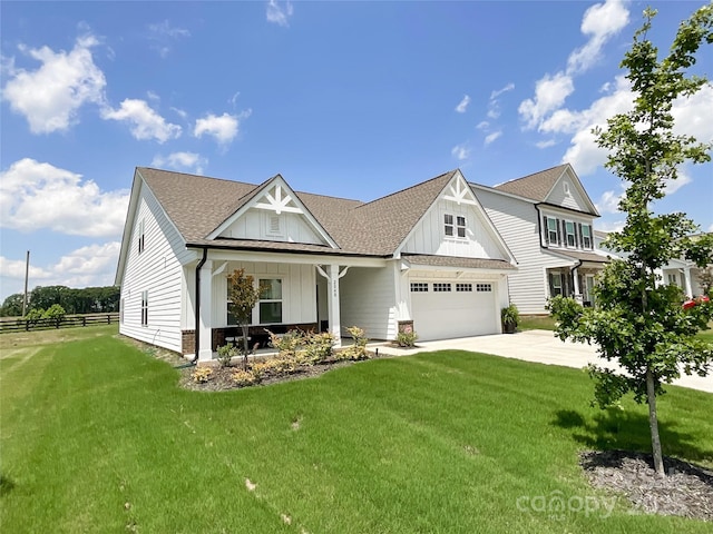 view of front of property featuring board and batten siding, driveway, covered porch, a shingled roof, and a garage