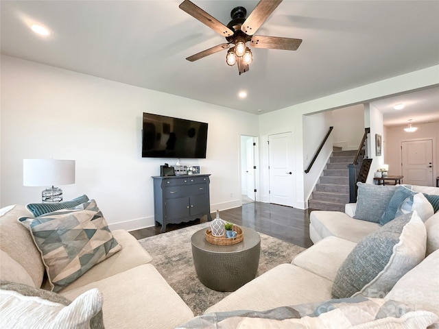 living room featuring stairway, ceiling fan, baseboards, dark wood-style floors, and recessed lighting