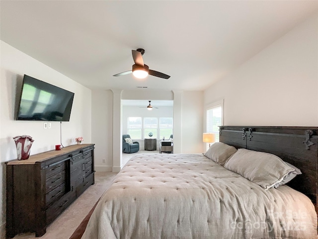 bedroom featuring light carpet and ceiling fan