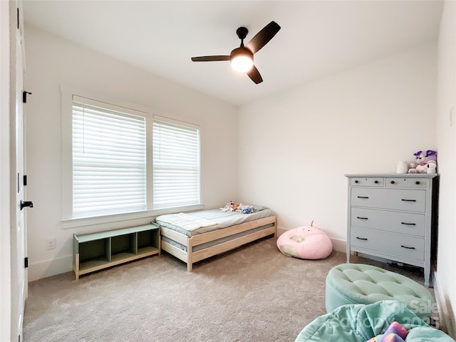bedroom featuring carpet, ceiling fan, and baseboards