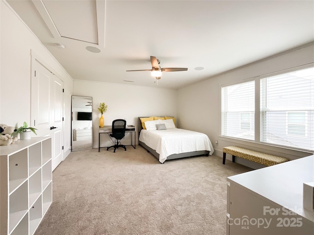 bedroom with light colored carpet and a ceiling fan