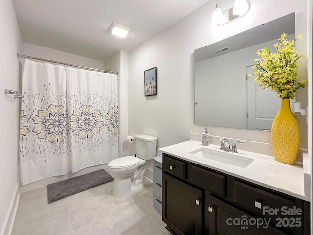 full bathroom with baseboards, toilet, and vanity