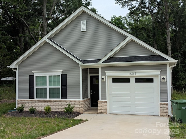 1604 N Main St, Mount Holly, NC 28120 - view of front of house featuring driveway and a garage