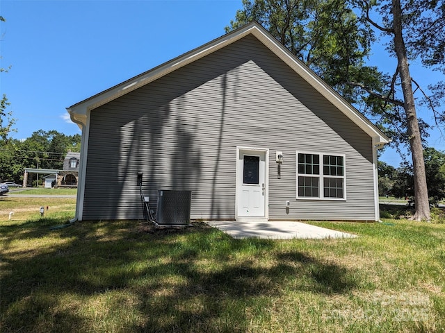 1604 N Main St, Mount Holly, NC 28120 - rear view of property with a yard, central AC unit, and a patio area
