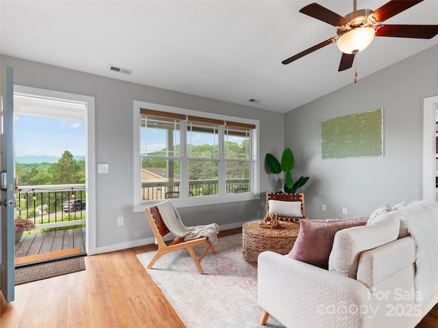 128 Lewis Ln, Candler, NC 28715 - living area with wood finished floors, a ceiling fan, vaulted ceiling, and baseboards