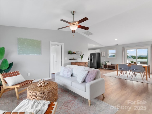 128 Lewis Ln, Candler, NC 28715 - living room featuring light wood-type flooring, ceiling fan, vaulted ceiling, and recessed lighting