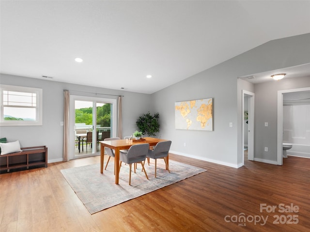 128 Lewis Ln, Candler, NC 28715 - dining space featuring wood finished floors, vaulted ceiling, baseboards, and recessed lighting