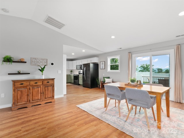 128 Lewis Ln, Candler, NC 28715 - dining room featuring lofted ceiling, light wood-type flooring, recessed lighting, and baseboards