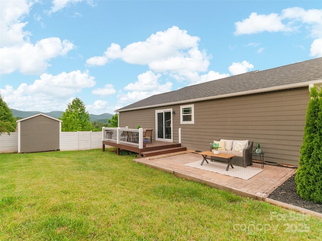 128 Lewis Ln, Candler, NC 28715 - rear view of property with a deck with mountain view and an outdoor hangout area