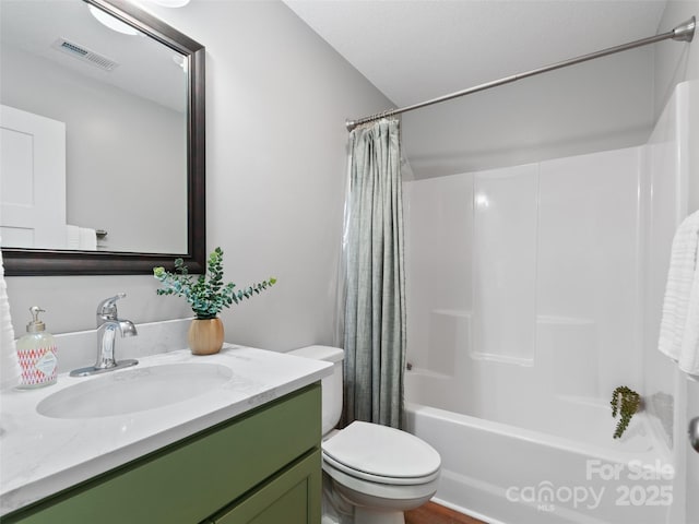 128 Lewis Ln, Candler, NC 28715 - full bathroom with vanity, toilet, and shower / tub combo with curtain
