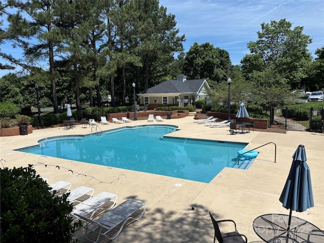 3602 Melrose Cottage Dr, Matthews, NC 28105 - community pool with fence, a patio area, and view of scattered trees
