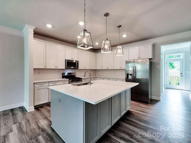 2001 Laurel Village Cir, Belmont, NC 28012 - kitchen with stainless steel appliances, a sink, crown molding, dark wood-type flooring, and a center island with sink