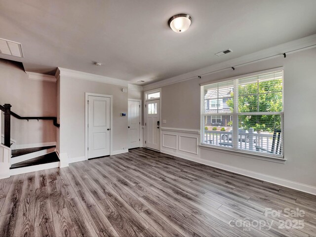 2001 Laurel Village Cir, Belmont, NC 28012 - foyer featuring wood finished floors, crown molding, baseboards, and stairway
