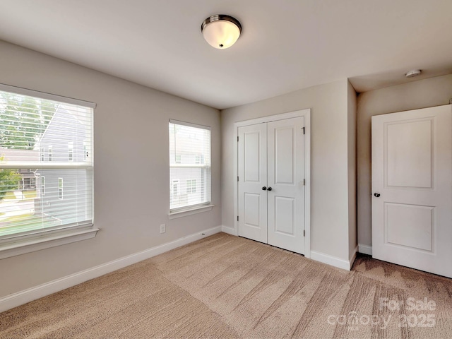 2001 Laurel Village Cir, Belmont, NC 28012 - unfurnished bedroom with carpet, multiple windows, and baseboards