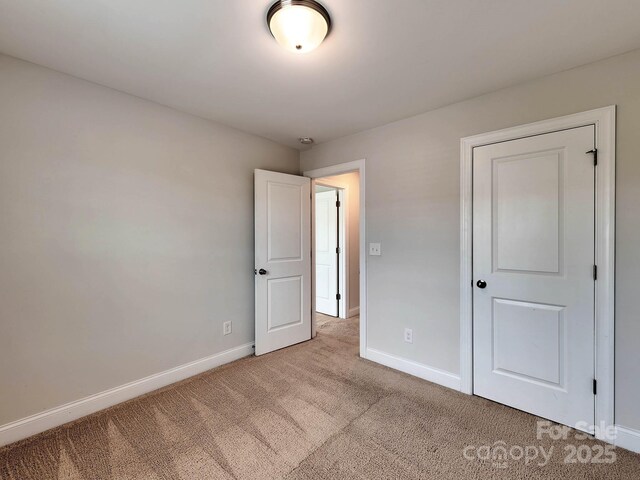 2001 Laurel Village Cir, Belmont, NC 28012 - unfurnished bedroom featuring carpet floors and baseboards