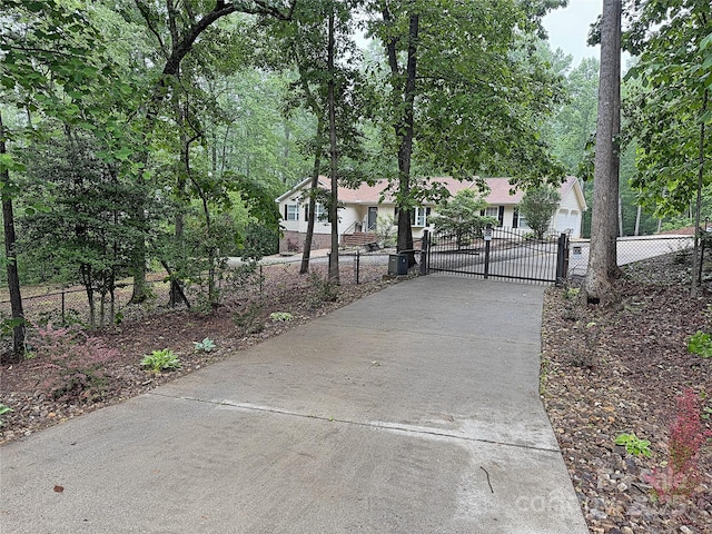 174 Sassafras Hill Dr Unit 41, Rutherfordton, NC 28139 - view of concrete driveway with a gate and a gated entry