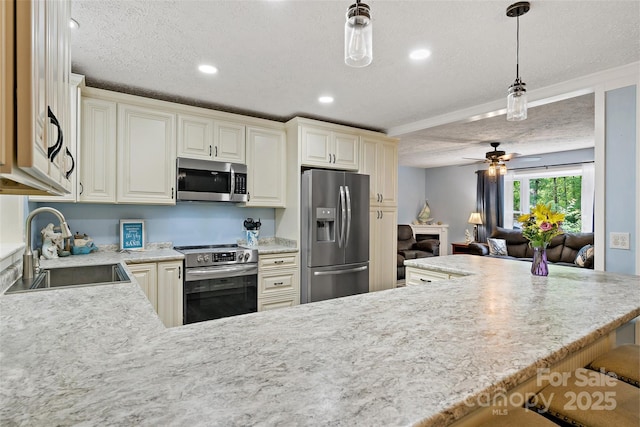 174 Sassafras Hill Dr Unit 41, Rutherfordton, NC 28139 - kitchen with appliances with stainless steel finishes, a sink, a textured ceiling, ceiling fan, and decorative light fixtures