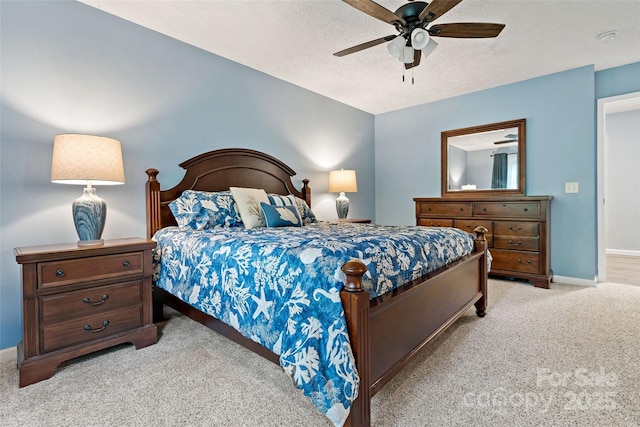 174 Sassafras Hill Dr Unit 41, Rutherfordton, NC 28139 - bedroom with light colored carpet, baseboards, a textured ceiling, and a ceiling fan
