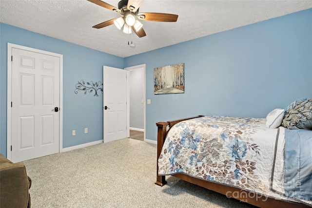 174 Sassafras Hill Dr Unit 41, Rutherfordton, NC 28139 - carpeted bedroom featuring baseboards, a textured ceiling, and a ceiling fan