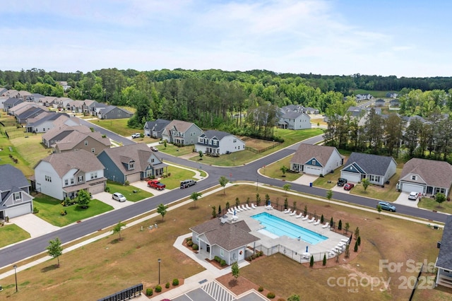 aerial view of residential area featuring a pool
