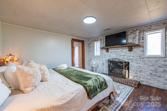 40 Painter Rd, Banner Elk, NC 28604 - bedroom featuring hardwood / wood-style floors and a brick fireplace