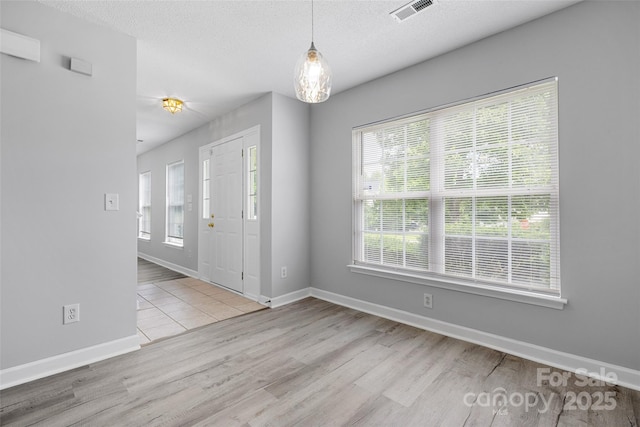 4004 Shasta Cir, Clover, SC 29710 - foyer featuring wood finished floors, baseboards, and a textured ceiling
