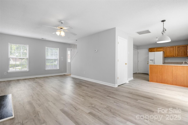 4004 Shasta Cir, Clover, SC 29710 - unfurnished living room with baseboards, light wood-style flooring, and ceiling fan