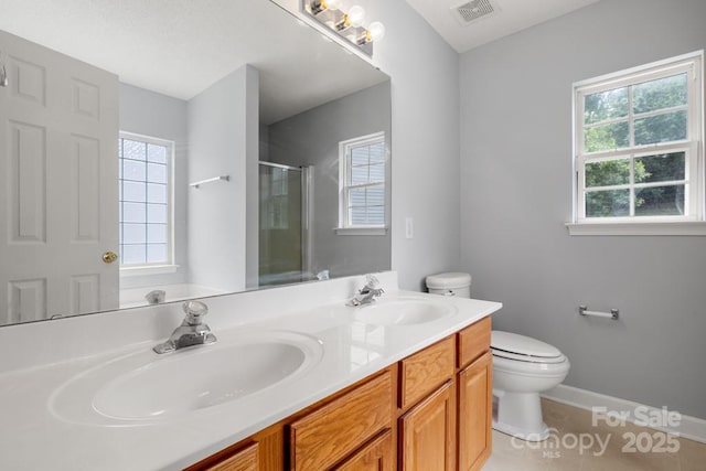 4004 Shasta Cir, Clover, SC 29710 - bathroom with toilet, a shower stall, tile patterned floors, double vanity, and baseboards