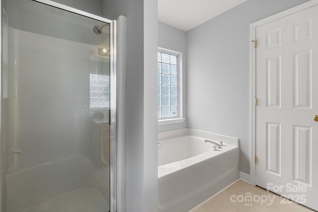 4004 Shasta Cir, Clover, SC 29710 - bathroom with a shower stall, a bath, tile patterned floors, and baseboards