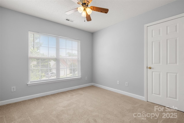4004 Shasta Cir, Clover, SC 29710 - spare room with light colored carpet, ceiling fan, baseboards, and a textured ceiling