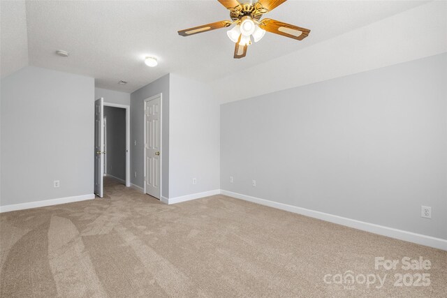 4004 Shasta Cir, Clover, SC 29710 - unfurnished room featuring lofted ceiling, light colored carpet, a ceiling fan, baseboards, and a smoke detector