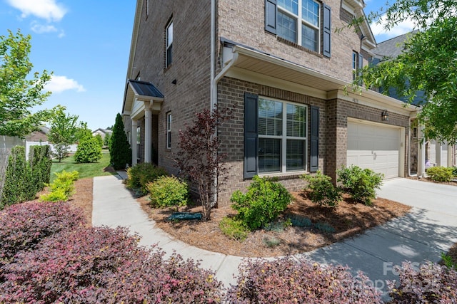4028 Woodsmill Rd, Fort Mill, SC 29707 - view of property exterior featuring brick siding and concrete driveway
